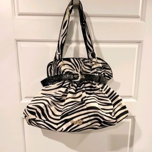 Foxy jeans zebra print purse.